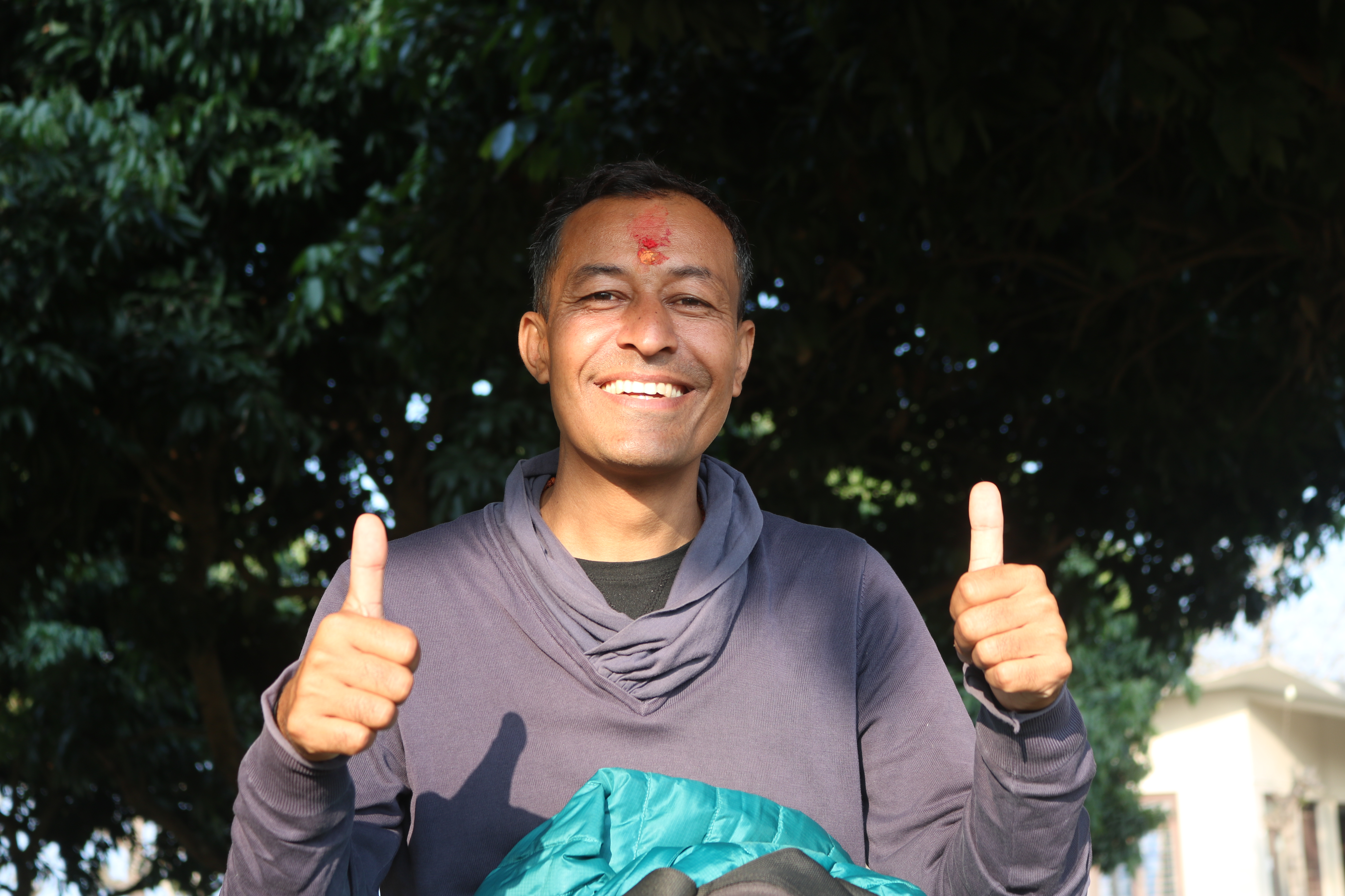Raj giving two thumbs up